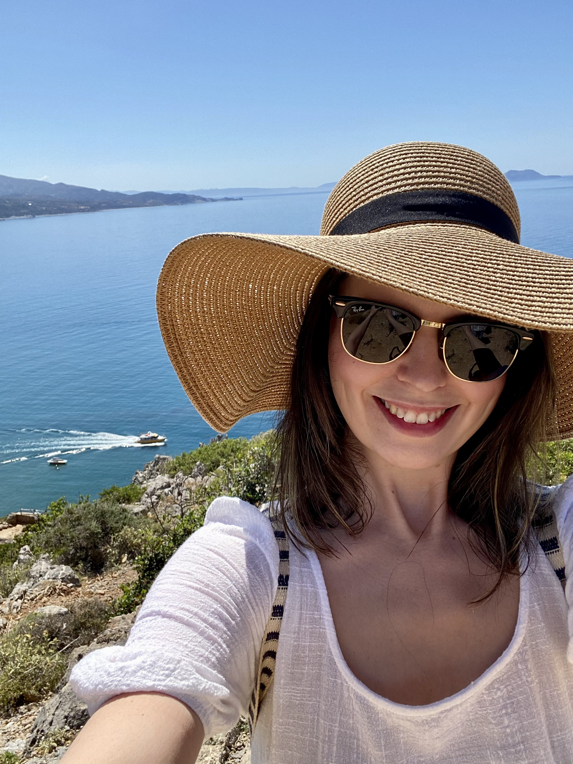 Rachel in a sun hat overlooking the Mediterranean sea